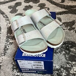 New in box Size 7/7.5 Iridescent Matcha Arizona Birkenstocks.